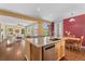 Open-concept kitchen featuring stainless appliances and a granite-topped island at 10550 Sedalia St, Commerce City, CO 80022