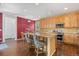 Spacious kitchen with stainless steel appliances, granite counters, and center island at 10550 Sedalia St, Commerce City, CO 80022