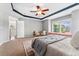 Spacious main bedroom with neutral colors, large windows, and stylish decor creating a serene retreat at 10550 Sedalia St, Commerce City, CO 80022