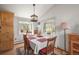 Eat-in kitchen featuring a breakfast table with views of the greenery outside the windows at 6584 Pike Cir, Larkspur, CO 80118