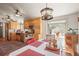 Eat-in kitchen area with rustic wooden cabinets, stainless steel appliances, and views of the surrounding landscape at 6584 Pike Cir, Larkspur, CO 80118