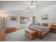 Bright main bedroom featuring a wooden platform bed with storage, and neutral decor, creating a serene retreat at 6584 Pike Cir, Larkspur, CO 80118