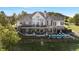 An outdoor view of the back of a multi-level home with a pool, deck, and lots of natural light at 4541 Tierra Alta Dr, Castle Rock, CO 80104