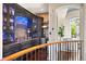 Custom bar area with stone accents, stylish cabinets, and display shelving for bottles at 4541 Tierra Alta Dr, Castle Rock, CO 80104