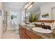 Bathroom with a wood-framed mirror, granite counters, and double sinks at 4541 Tierra Alta Dr, Castle Rock, CO 80104