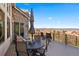 Outdoor deck featuring scenic views, a dining table with chairs and lounge seating at 4541 Tierra Alta Dr, Castle Rock, CO 80104