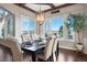 Charming dining room with scenic views, elegant lighting, and comfortable seating at 4541 Tierra Alta Dr, Castle Rock, CO 80104