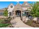 Charming front entry with stone accents, beautiful landscaping, and a welcoming walkway at 4541 Tierra Alta Dr, Castle Rock, CO 80104