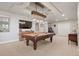 Spacious game room features a pool table, modern lighting, and a large flat screen TV at 4541 Tierra Alta Dr, Castle Rock, CO 80104