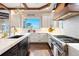 Well-appointed kitchen with a large island, modern appliances, and a bright, airy feel at 4541 Tierra Alta Dr, Castle Rock, CO 80104