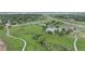 Aerial view of a neighborhood featuring green space, community pool, a creek, and highway access at 8307 S Garland Cir, Littleton, CO 80128