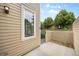 Back of the property showcasing the patio area, private gate, and lovely trees at 8307 S Garland Cir, Littleton, CO 80128