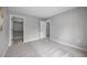 Spacious bedroom featuring a walk-in closet and neutral tones at 8307 S Garland Cir, Littleton, CO 80128