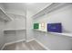 Walk-in closet with ample shelving and storage space at 8307 S Garland Cir, Littleton, CO 80128
