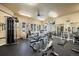 Well-equipped fitness center featuring various exercise machines and natural light from large windows at 8307 S Garland Cir, Littleton, CO 80128