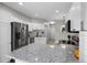 Updated kitchen featuring granite countertops, stainless steel appliances, and white cabinets at 8307 S Garland Cir, Littleton, CO 80128