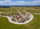 Aerial view of the Beeler Park open space showing walking paths, a playground and views at 5716 Boston Ct, Denver, CO 80238