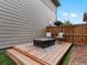 Cozy backyard deck with outdoor seating and a fire pit, perfect for relaxing evenings at 5716 Boston Ct, Denver, CO 80238