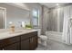 Updated bathroom featuring a tub shower with tiled surround and modern fixtures at 5716 Boston Ct, Denver, CO 80238