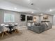 Finished basement with a seating area, tv, and bar at 5716 Boston Ct, Denver, CO 80238