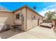 Cozy backyard with a small patio, perfect for outdoor grilling and entertaining with trailer parked on driveway at 2281 Oak Pl, Thornton, CO 80229