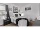 Comfortable bedroom with soft bedding, contemporary décor, and serene ambiance for relaxation at 2281 Oak Pl, Thornton, CO 80229