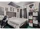 A large gray bed dominates this bedroom, with decorative wall art and dark curtains at 2281 Oak Pl, Thornton, CO 80229