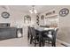 This dining room offers a marble table, seating for six, and a beverage cooler at 2281 Oak Pl, Thornton, CO 80229