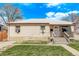 Charming single-story home with a well-maintained lawn and inviting front porch at 2281 Oak Pl, Thornton, CO 80229
