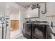 Well-equipped laundry room featuring modern appliances, ample storage, and functional design for convenience at 2281 Oak Pl, Thornton, CO 80229