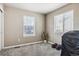 Versatile room with two large windows, neutral carpet and walls, suitable for various uses at 12835 Randles Ave, Parker, CO 80134