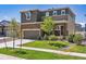 Two story home featuring stone accents, well manicured lawn and attached two car garage at 12835 Randles Ave, Parker, CO 80134