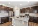 Kitchen area featuring stainless steel appliances, granite countertops and kitchen island at 12835 Randles Ave, Parker, CO 80134