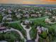 Expansive aerial view of a luxury neighborhood with sprawling green lawns and elegant homes at 485 Sapphire Dr, Castle Rock, CO 80108