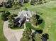 Stunning aerial view of a home showcasing its expansive yard, private driveway, and lush landscaping at 485 Sapphire Dr, Castle Rock, CO 80108
