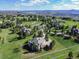 Picturesque aerial view of a residential area nestled in rolling hills, showing mountain views and spacious lots at 485 Sapphire Dr, Castle Rock, CO 80108