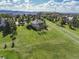 Aerial view of estate home surrounded by green space and white fencing at 485 Sapphire Dr, Castle Rock, CO 80108