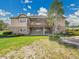 Sprawling backyard with lush green grass, a stone-clad patio, and a large deck perfect for entertaining at 485 Sapphire Dr, Castle Rock, CO 80108