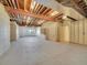 Unfinished basement with exposed ceiling beams, concrete floors and walls ready to be customized at 485 Sapphire Dr, Castle Rock, CO 80108