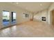 Finished basement with a fireplace, tile flooring, and walkout to patio at 485 Sapphire Dr, Castle Rock, CO 80108