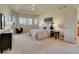 Spacious bedroom with trey ceilings, large windows, and a ceiling fan at 485 Sapphire Dr, Castle Rock, CO 80108