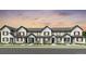 New construction exterior elevation of townhomes in a row with white siding and black trim and a beautiful sunset at 6641 E 148Th Dr # 4, Thornton, CO 80602
