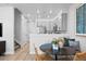 Eat-in kitchen with stainless steel appliances, gray cabinets and hardwood floors, with decorative accessories at 6641 E 148Th Dr # 4, Thornton, CO 80602