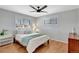 Bright bedroom featuring hardwood floors, a ceiling fan and plenty of natural light through dual windows at 4040 S Inca St, Englewood, CO 80110
