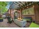 Outdoor living space featuring brick patio, fire pit, comfortable seating and pergola with string lights at 3470 S Race St, Englewood, CO 80113