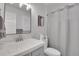 Bathroom with a single vanity, standard toilet, and shower with curtain at 3470 S Race St, Englewood, CO 80113