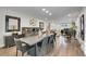 Open dining room with sleek furniture and stylish decor leading to other living areas in the home at 3470 S Race St, Englewood, CO 80113