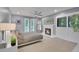 Serene main bedroom featuring a fireplace and ample natural light at 3470 S Race St, Englewood, CO 80113