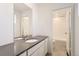 Tastefully-designed bathroom featuring a modern vanity with a large mirror and great lighting at 24716 E Evans Dr, Aurora, CO 80018