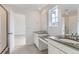 Beautifully designed bathroom featuring a double sink vanity and a glass enclosed shower at 24716 E Evans Dr, Aurora, CO 80018